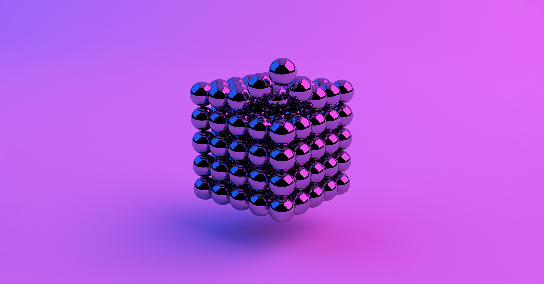 Cube made of metal balls, pink bue