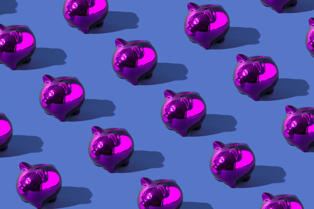 Small shiny piggy banks, purple with blue backgorund
