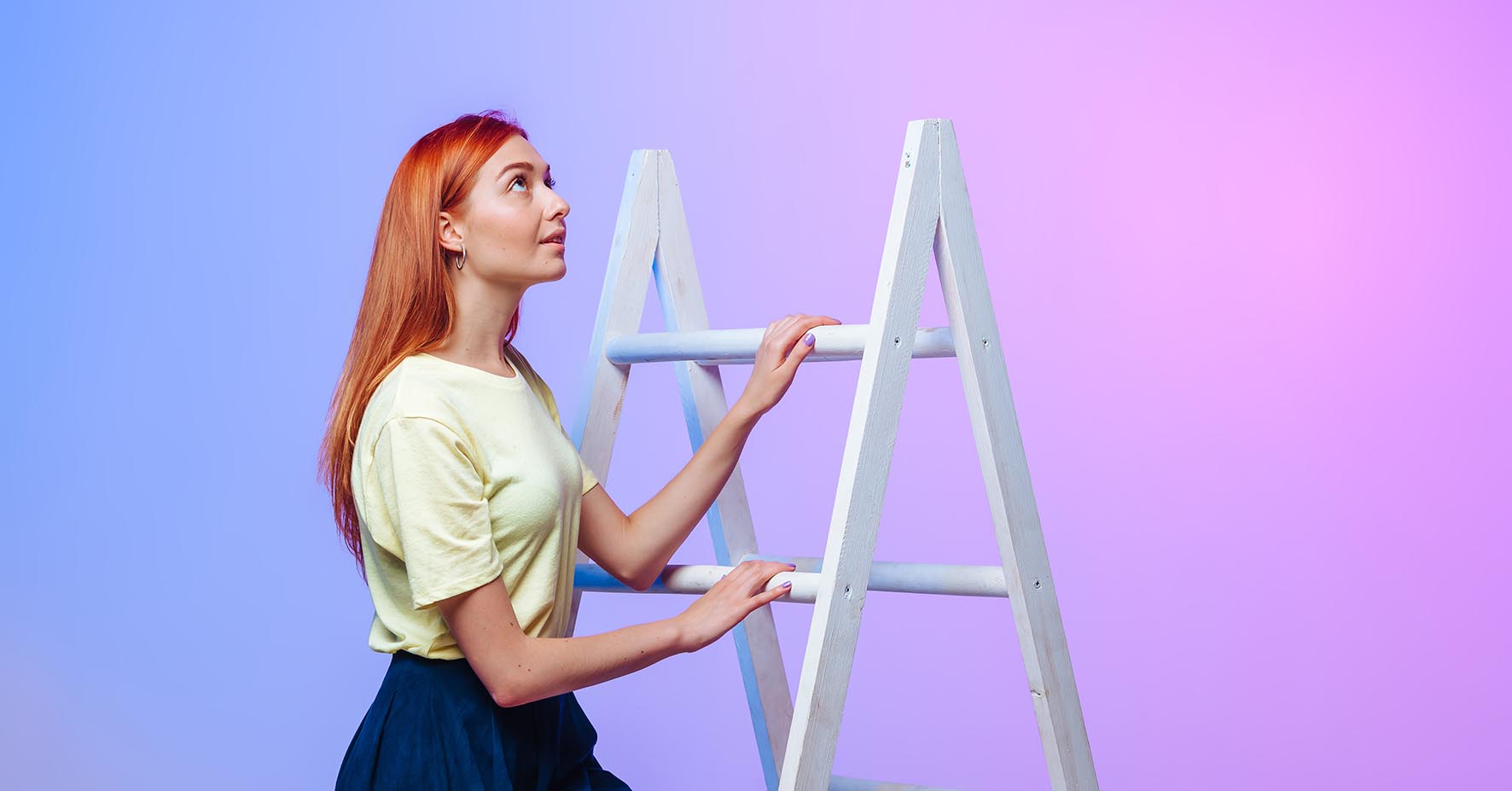 Woman ginger climbing a ladder, blue/pink background